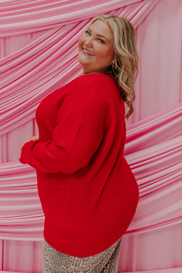 A cozy knit sweater top designed for a flattering and comfortable fit.